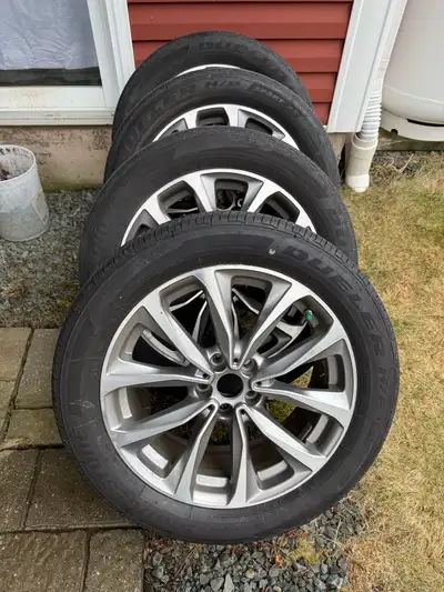 Selling a set of BMW 2018 X3 rims with all-season tires, size 245/50R19.