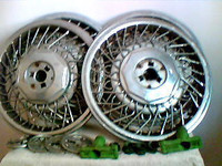 4 Chrome Spoked -15in hubcaps with accessories.