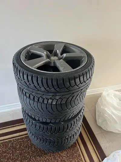 Selling a set of used winter tires, size 225 40 r18, mounted on 18-inch Mazda steel rims. These tire...