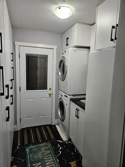Two clean, furnished rooms are available in a quiet, well‑maintained female‑only basement near Rossl...