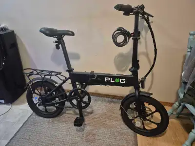 Plug folding e-bike with charger and bike lock. Around 3 years old, but hasn't been used in about a...