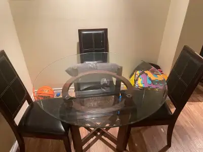 Glass round dining table ideal for small family Used for a few years Need to go asap Nothing is brok...