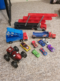 Plastic transport trucks and toy car lot