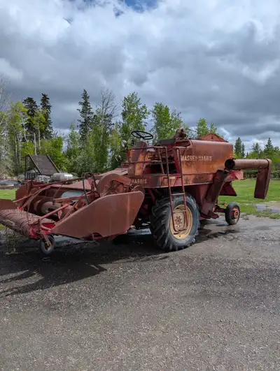 Old Massey Harris 92 Combine. It was operational when it was shut off. All parts still on it. Great...