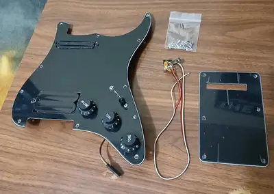 Brand new with plastic on it. This features 4 sounds per pickup selection. The bridge pickup is a CO...