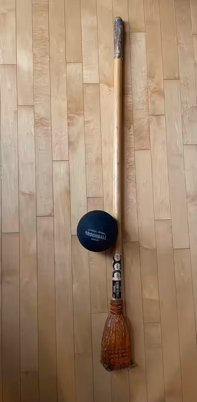 Broomball broom and ball.