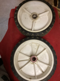 Two lawnmower wheels