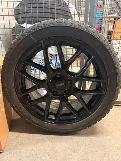Upgrade your ride with this set of high-quality RSSW wheels paired with reliable Michelin Ice winter...