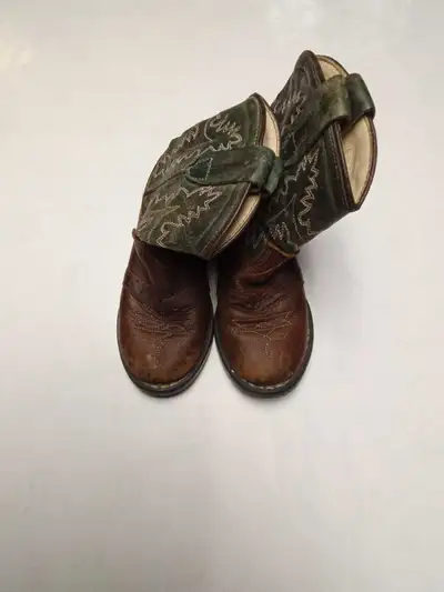 These are toddler-sized cowboy boots, perfect for your little buckaroo; they have a charming rustic...