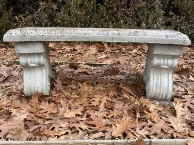 Decorative stone garden bench. weathered piece with a classic design. Comes in 3 pieces. About 3ft w...