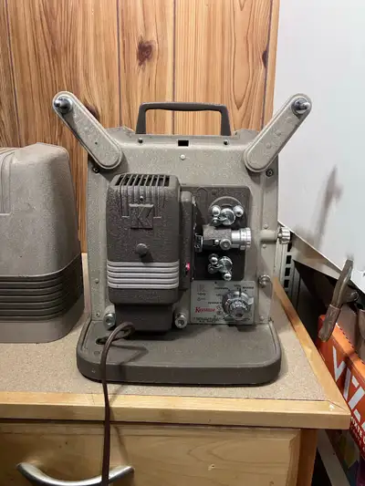Capture memories with this vintage Keystone K-100 8mm film projector! This classic movie projector i...