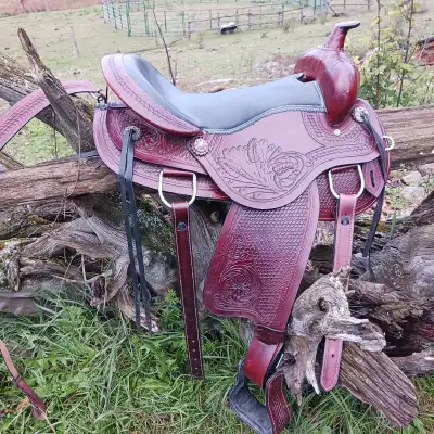 Beautiful western saddle for sale. It's a 16 inch seat and comes with a breast color. It is a lighte...