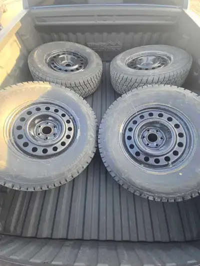 Bridgestone Blizzak DM-V2 winter tires in size 265/70R17. On rims with sensors. Used for barely 1 se...