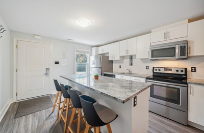 In a very clean townhouse, a room with private bathroom, shared kitchen and living space, in unit la...