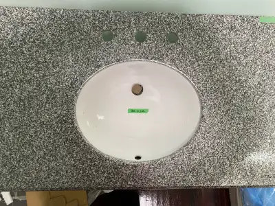 Beautiful Granite vanity top measuring 37 by 22 with 3 pre drilled holes …….paid over $700.00 reduce...