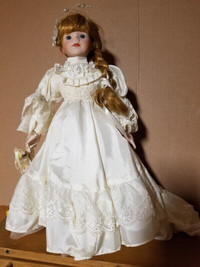 Doll - in bridal dress with beautiful face