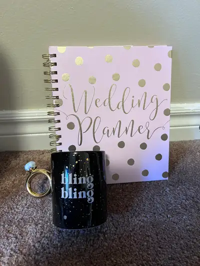 1. Bling Bling mug with handle as engagement ring 2. Wedding Planner Book Excellent gift for someone...