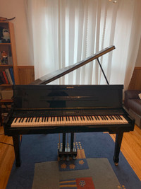 A electrical Suzuki Baby Grand Piano to give away