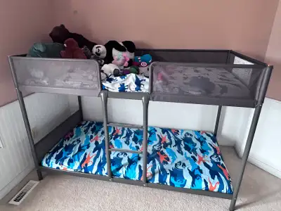 This is an IKEA bunk bed complete with a mattress, perfect for kids or guest rooms. It's in used con...