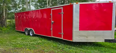30 feet long enclosed cargo trailer. Walls and ceiling are spray foam insulated. Two Heaters install...