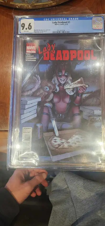 This Lady Deadpool #1 comic book, graded CGC 9.6, features stunning cover art and a thrilling story,...