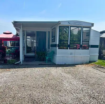 It's a really nice unit on a beautiful lot in Wildwood Golf and RV Resort, a 50+ resort. It has an e...