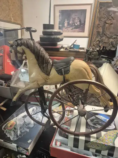 This is a beautiful hand carved wooden tricycle with cast iron wheels a great display in your home o...