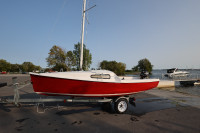 Sirocco 15 Sailboat, 2.5 hp Mercury outboard, and trailer