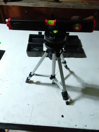 Laser level with a tripod makes it easy set your mark, square a corner or level new side walk.