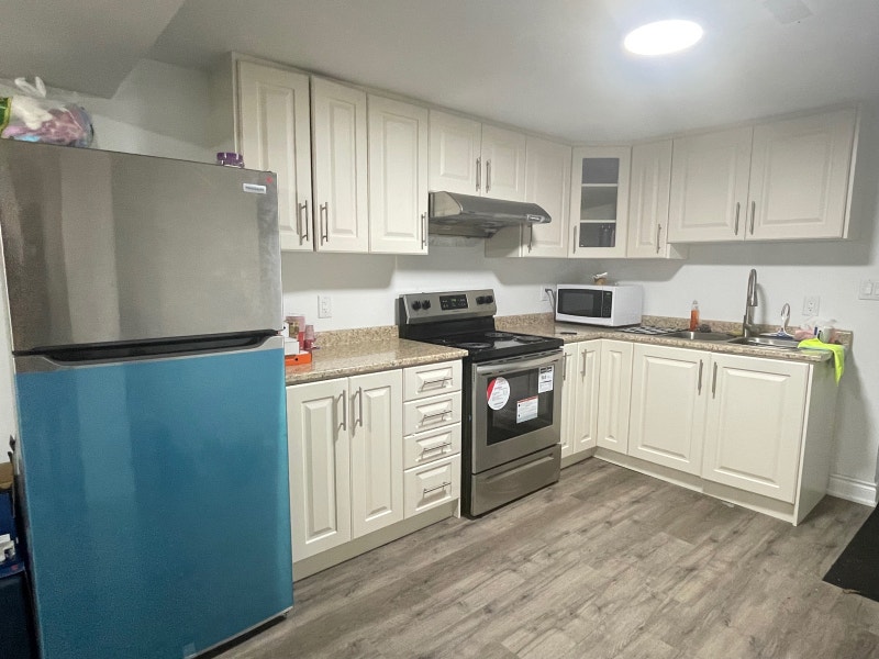 Master bedroom with private bath available in shared basement Long