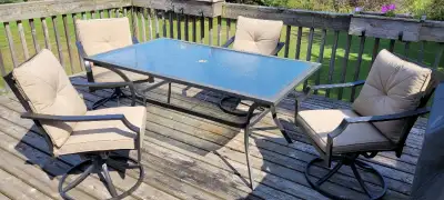 Tempered glass patio table and 4 swivel chairs with cushions, View more