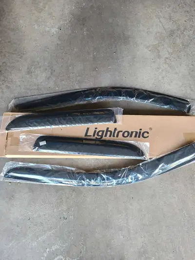 I'm selling a new Lightronic WV194109 in-channel window deflector and rain guard set, complete with...