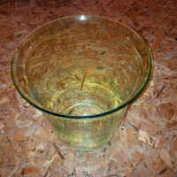 Glass Vase measures 10.5 inches high and 9 inches in diameter