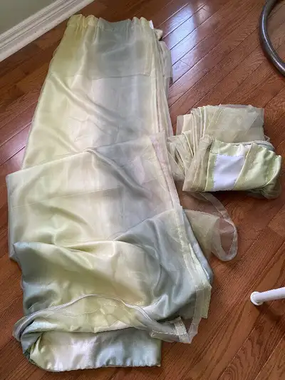 A pair of long window curtains … double layer of light green colors. Heavy and thick.Meet at Markham...