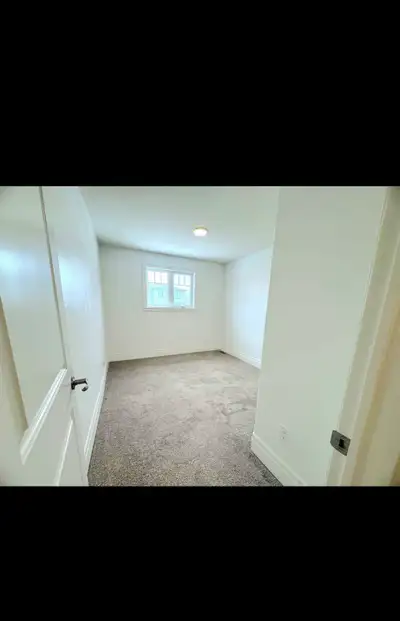 Private room available for a girl in three bedroom home.