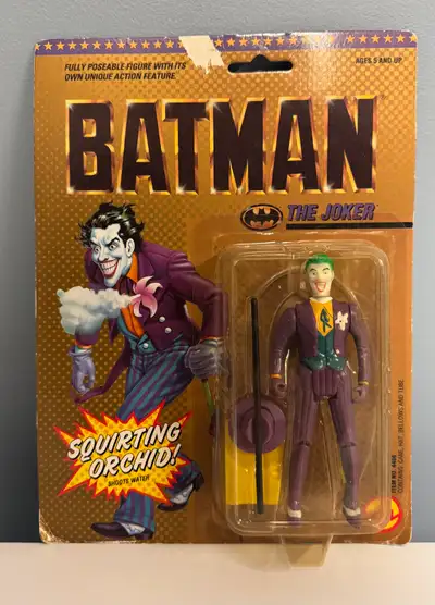 Batman 1989, The Joker action figure. Toy Biz. New, sealed. Package is damaged, figure remains seale...