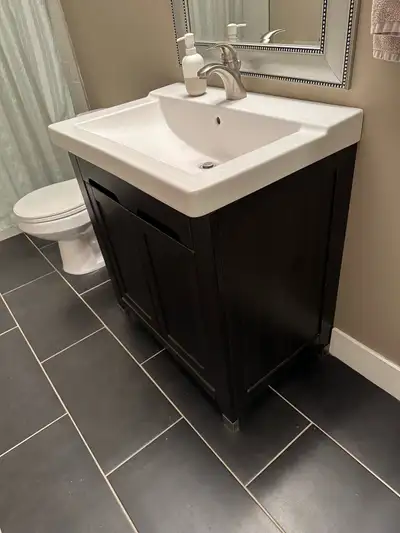 Good condition free standing bathroom vanity with faucet. $200 Measures 21 1/4 deep 32 inches wide 3...