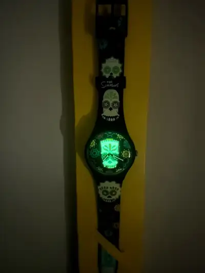 Swatch “D’oh Of The Dead” Glow in the Dark Simpsons Watch, View more