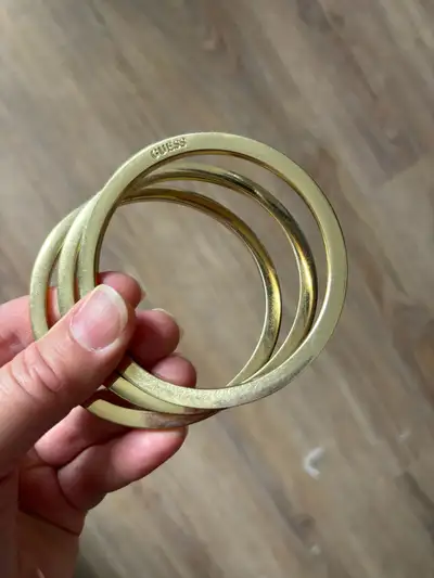 Guess Wavey gold colour metal bangal bracelets costume jewelry $5 for all ( set of three)