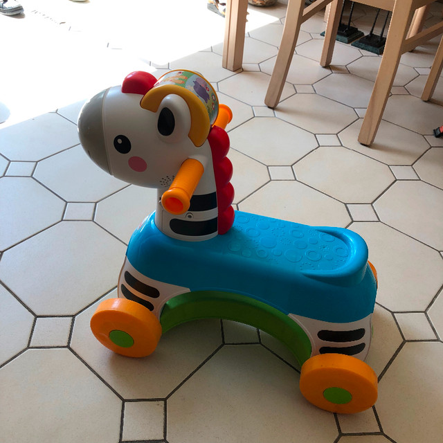 Fisher Price Ride on MUSICAL Zebra - like new! (Mumford Rd) in Toys in City of Halifax