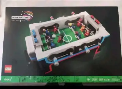 Bring the excitement of the stadium home with this LEGO Ideas Table Football set, model number 21337...