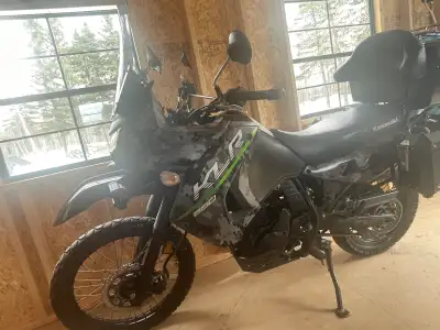 This reliable Kawasaki KLR 650 is a versatile dual-sport motorcycle featuring a 650cc engine and dig...