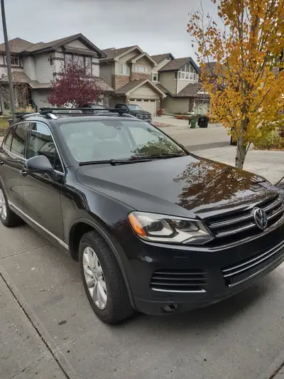 Practically one owner!! Options include: Black leather interior, heated front seats, heated steering...