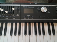 Roland V-Combo synthesizer with stand and cover.