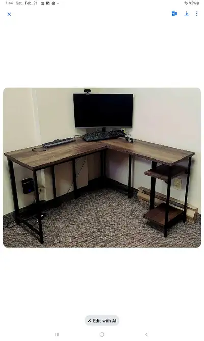 This L-shaped desk features a sturdy construction and a spacious work surface, perfect for home offi...