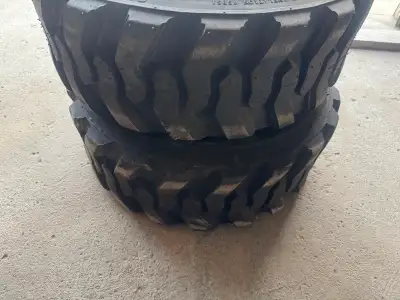For Sale: Bobcat tires and rims in excellent condition. Includes 2 heavy-duty Bobcat tires with rims...