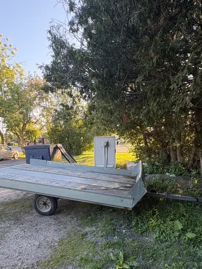 Homemade double galvanized tilt skidoo trailer with side walls. In perfect working order. no longer...
