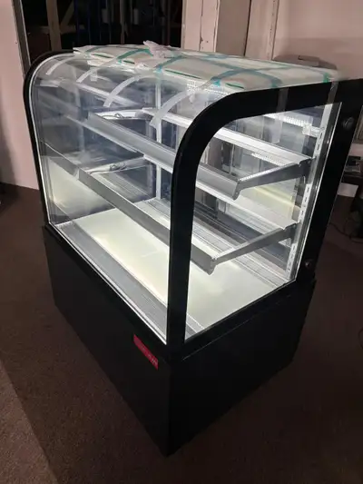 New Air NDC-36-CG refrigerated showcase in like-new condition. This is a showroom/display unit and h...