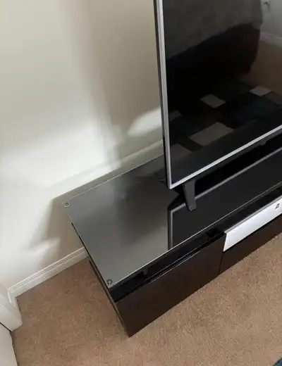 LG TV and dark brown/black TV stand media console with glass top, View more