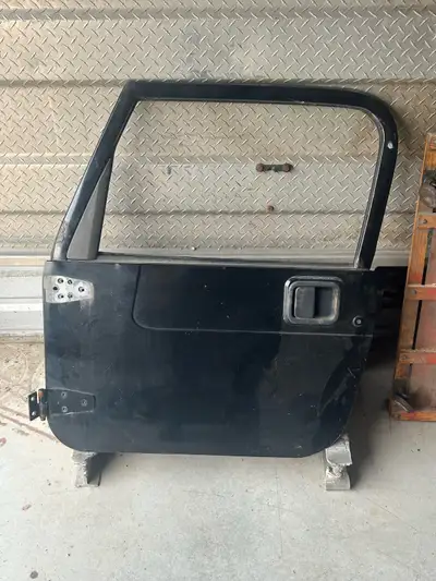 This is a Jeep Wrangler TJ left side door, perfect for replacing a damaged one. Has some lite rust a...
